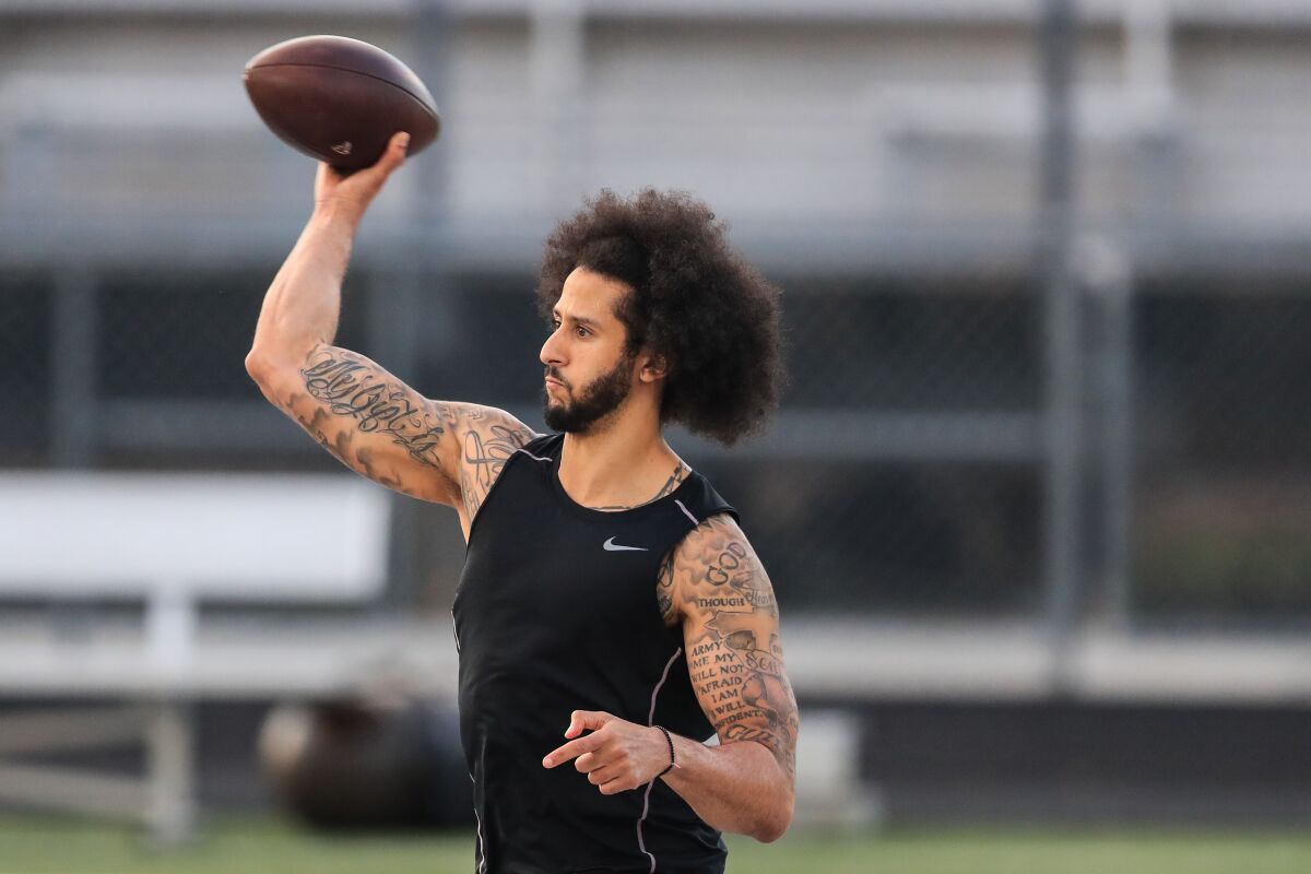 Colin Kaepernick throws a football at a private workout.