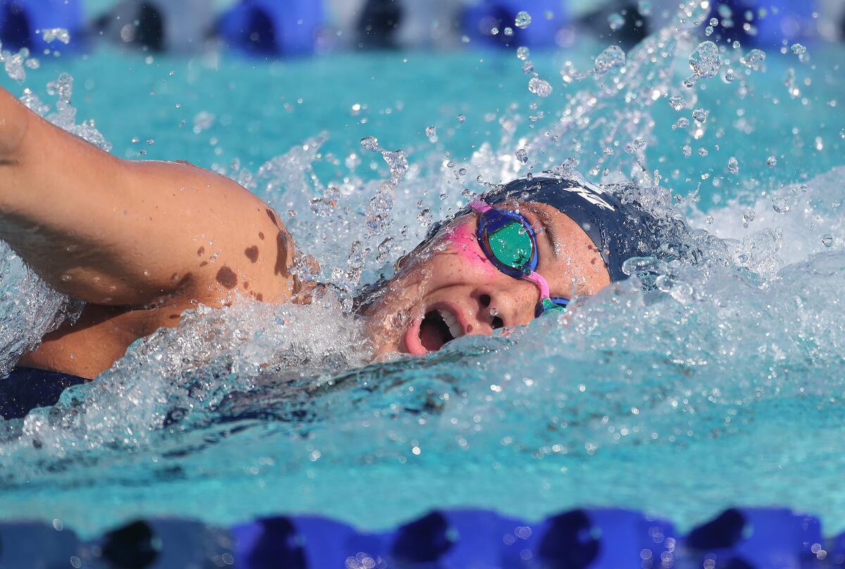 Nikki Lahey of Corona del Mar swims the girls' 100 yard freestyle in the Battle of the Bay on Tuesday.