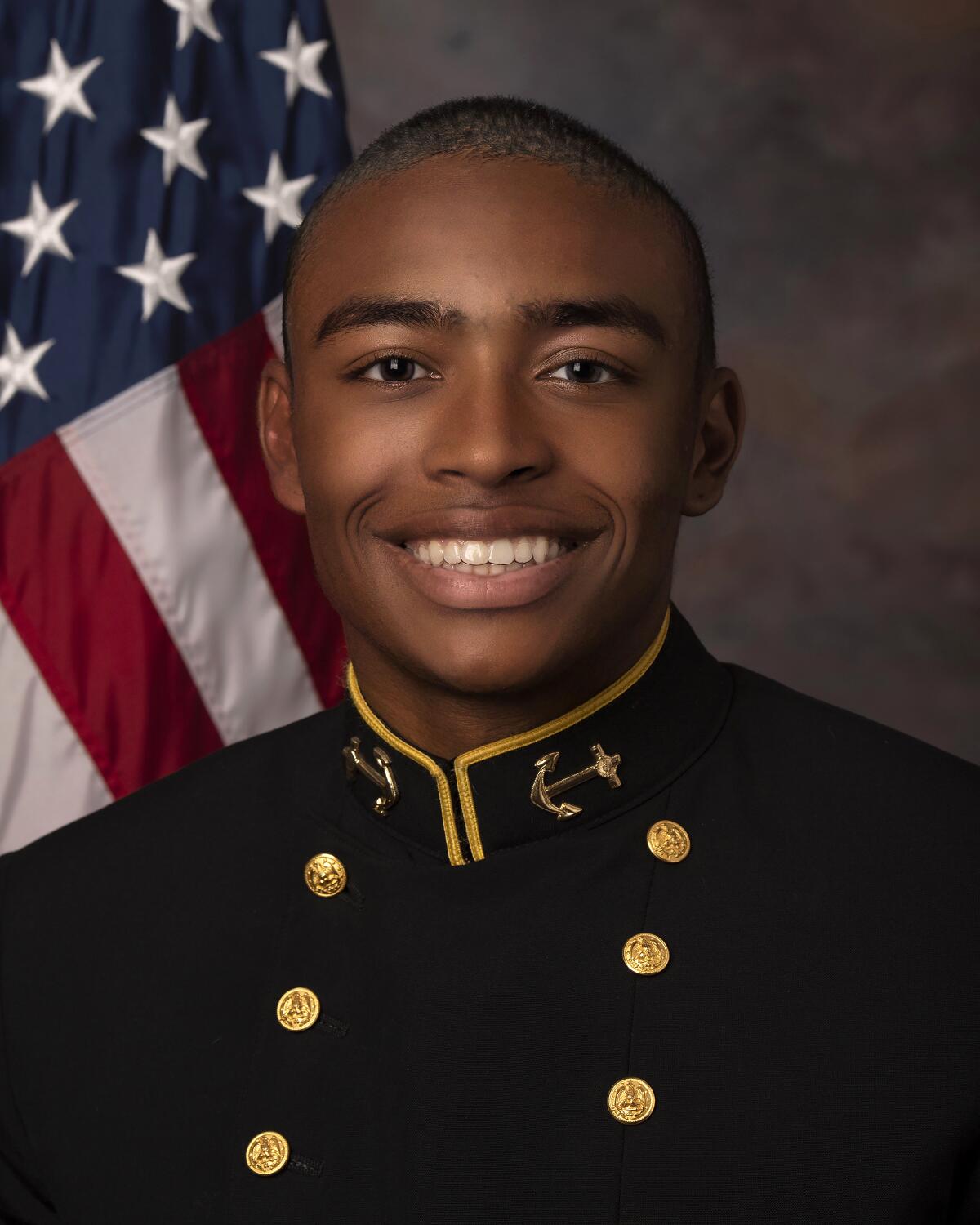 Navy cornerback Elias Larry poses for a photo in uniform.