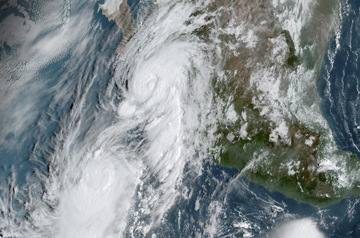 A satellite image shows Hurricane Lorena and Tropical Storm Mario
