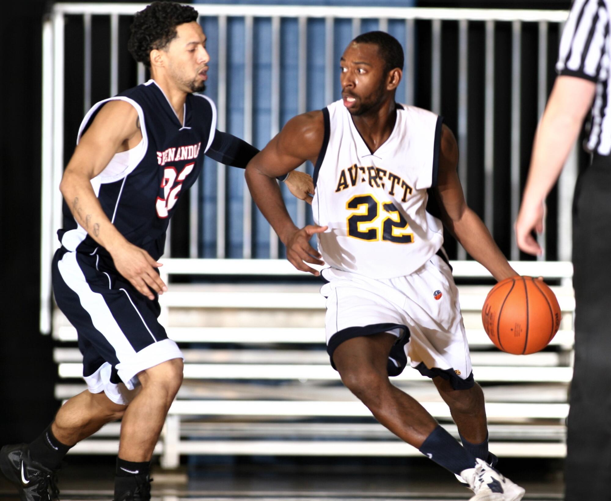 Justin Pierce, while playing for Averett University, drives against an opponent.