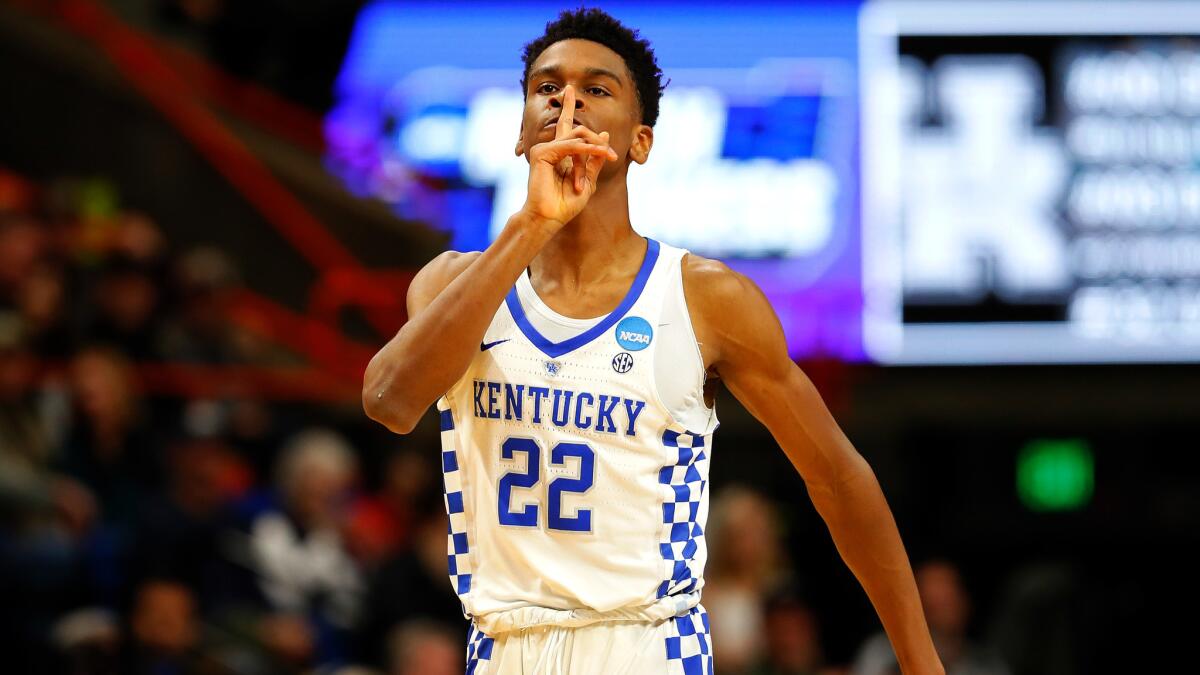 Kentucky's Shai Gilgeous-Alexander tries to silence the crowd after scoring against Buffalo during the first half Saturday.