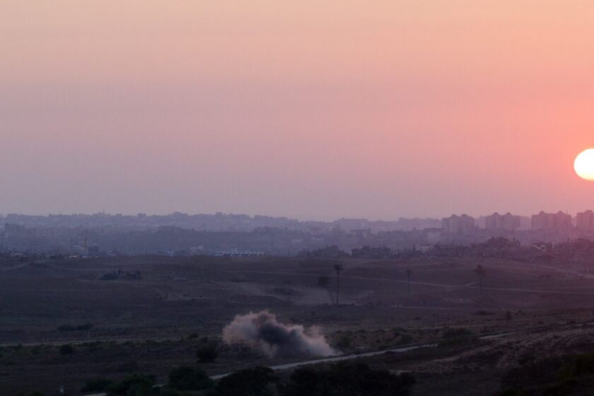 A mortar shell fired by Palestinian militants inside the Gaza Strip explodes near the border with Israel just before sunset Monday. Iranian officials say they have provided weapons technology to Hamas militants to defend Palestinians from Israeli forces.