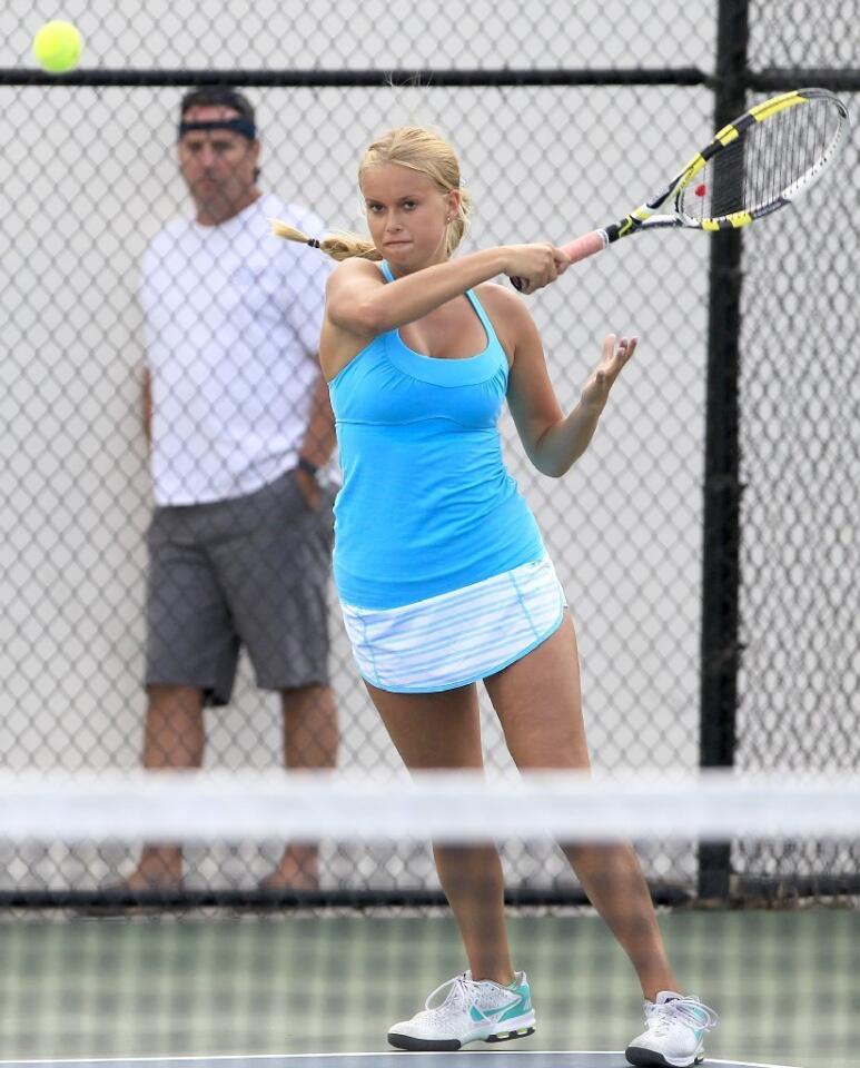 Corona del Mar High's Siena Sharf won twice in doubles against Newport Harbor in the Battle of the Bay match on Tuesday.