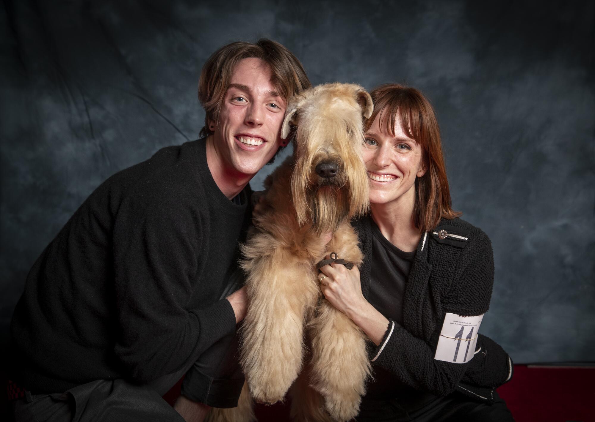  Daniel Faber, 24, and sister Brittany Faber, 31, of Los Angeles, pose with Neville, a 13-month-old, 35-lb soft-coated wheaten terrier. 