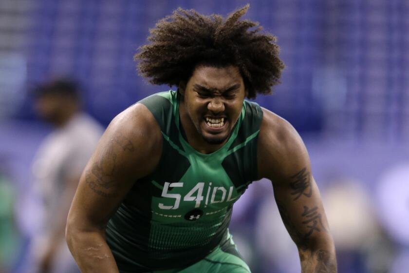 USC defensive end Leonard Williams runs through a drill at the NFL scouting combine in Indianapolis on Feb. 22.