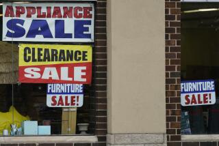 Sale signs are displayed at an appliance store in Arlington Heights, Ill., Wednesday, Nov. 8, 2023. On Tuesday, the Labor Department issues its report on inflation at the consumer level in October. (AP Photo/Nam Y. Huh)