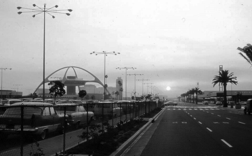 A 1964 photo captures an Atomic Age sunrise at Los Angeles International Airport, where streetlights had eight heads.