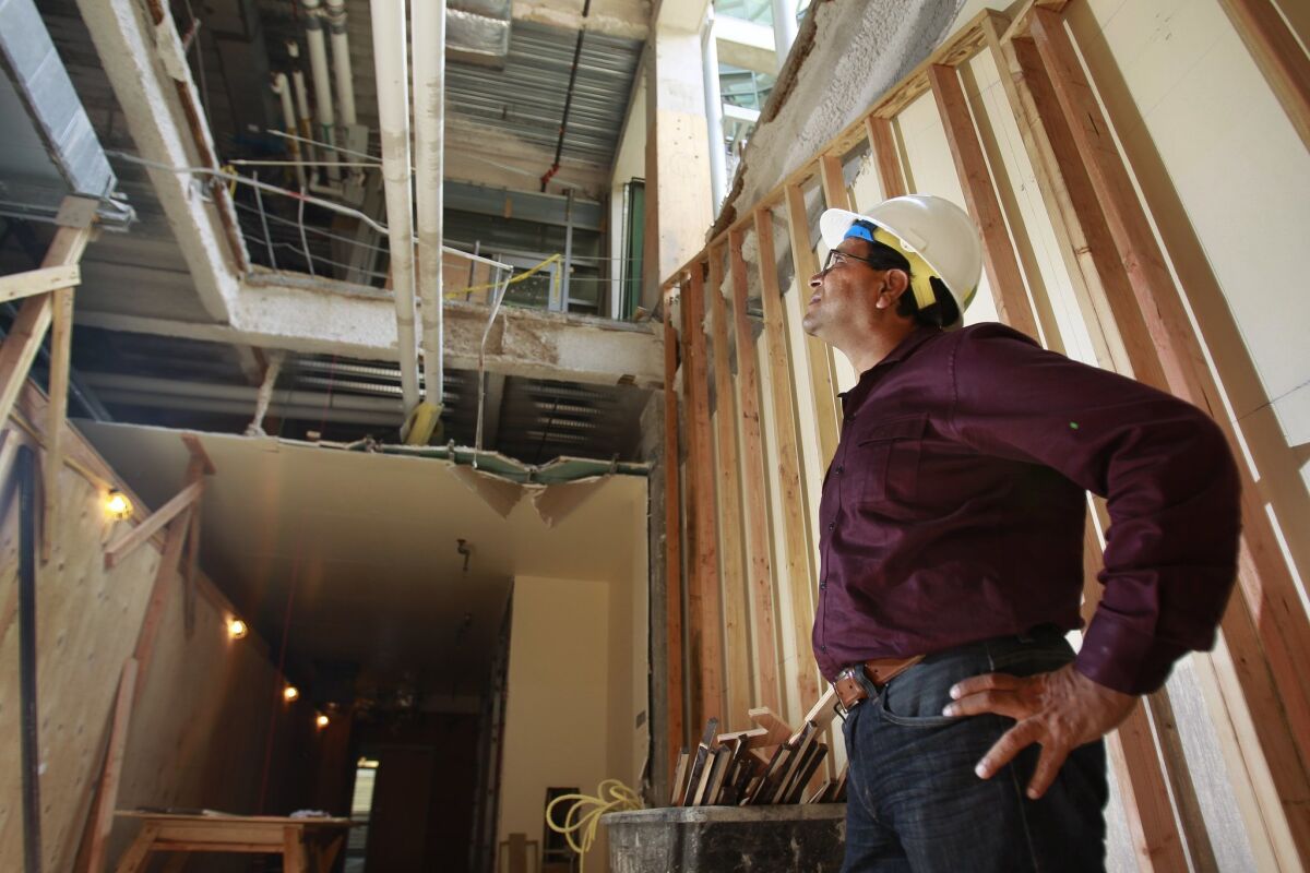 Rajesh Gupta, who recently finished serving as chair of UC San Diego's computer science department, on Thursday surveyed the stairway being constructed so students in the building's basement can more easily access the upper floors.