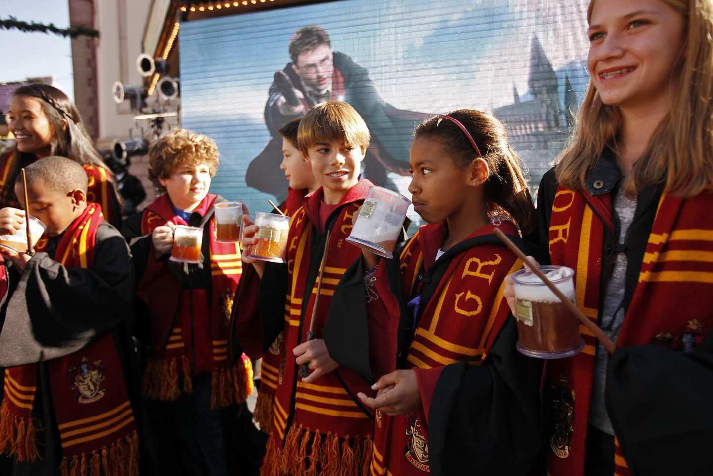 Studio execs and Gov. Jerry Brown joined the actors who play the Weasley twins in the "Harry Potter" films and a group of hardcore Potter fans in hoisting mugs of Butterbeer on Tuesday to celebrate the announcement that the Wizarding World of Harry Potter will be opening at Universal Studios Hollywood. The attraction has been a blockbuster success for the theme park in Orlando, so it makes sense to transpose it to the West Coast. The park renovation will include construction of Hogwarts Castle and will generate an estimated 1,000 jobs.