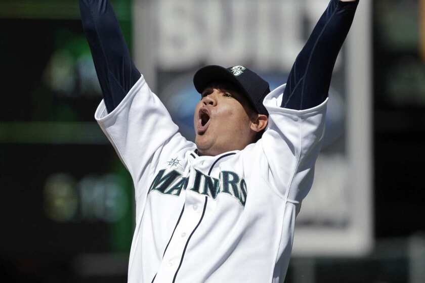 Mariners pitcher Felix Hernandez reacts after striking out Sean Rodriguez of Tampa Bay in the ninth inning to complete a perfect game against the Rays.