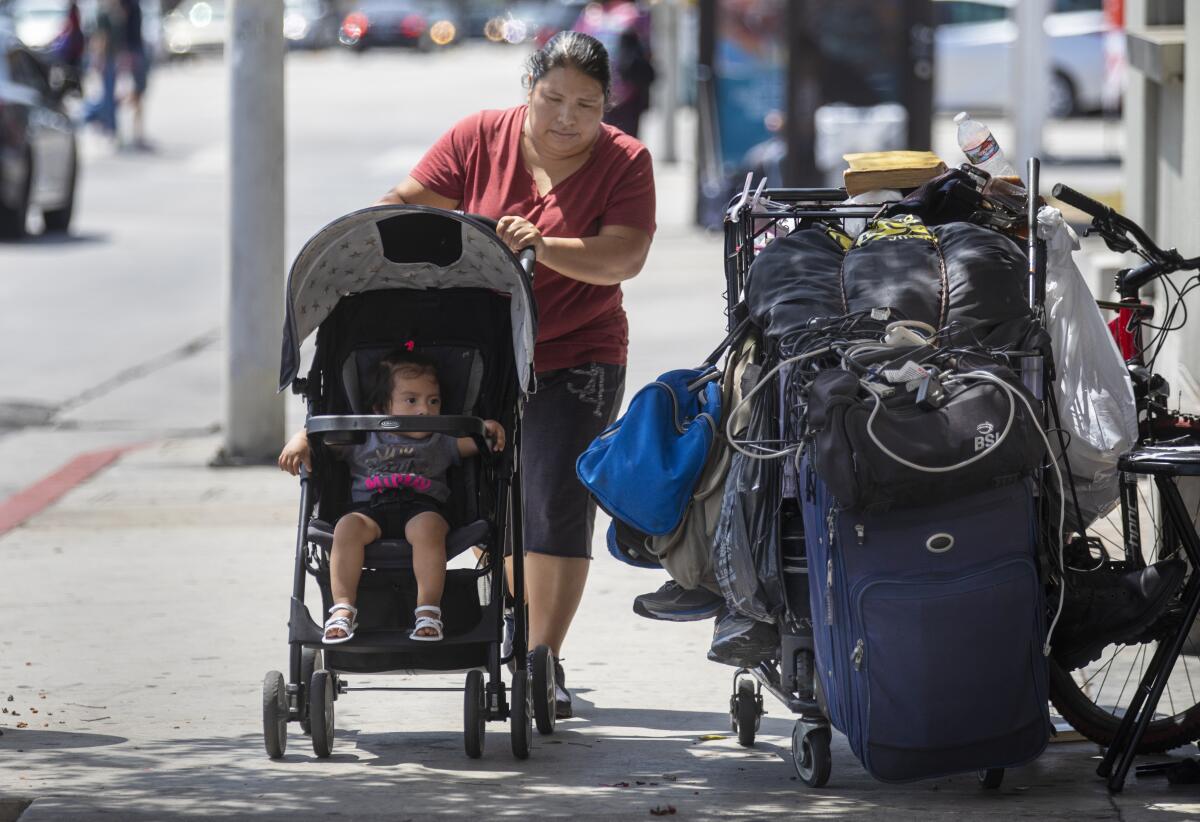 Homeless man sleeping on sidewalk in Koreatown