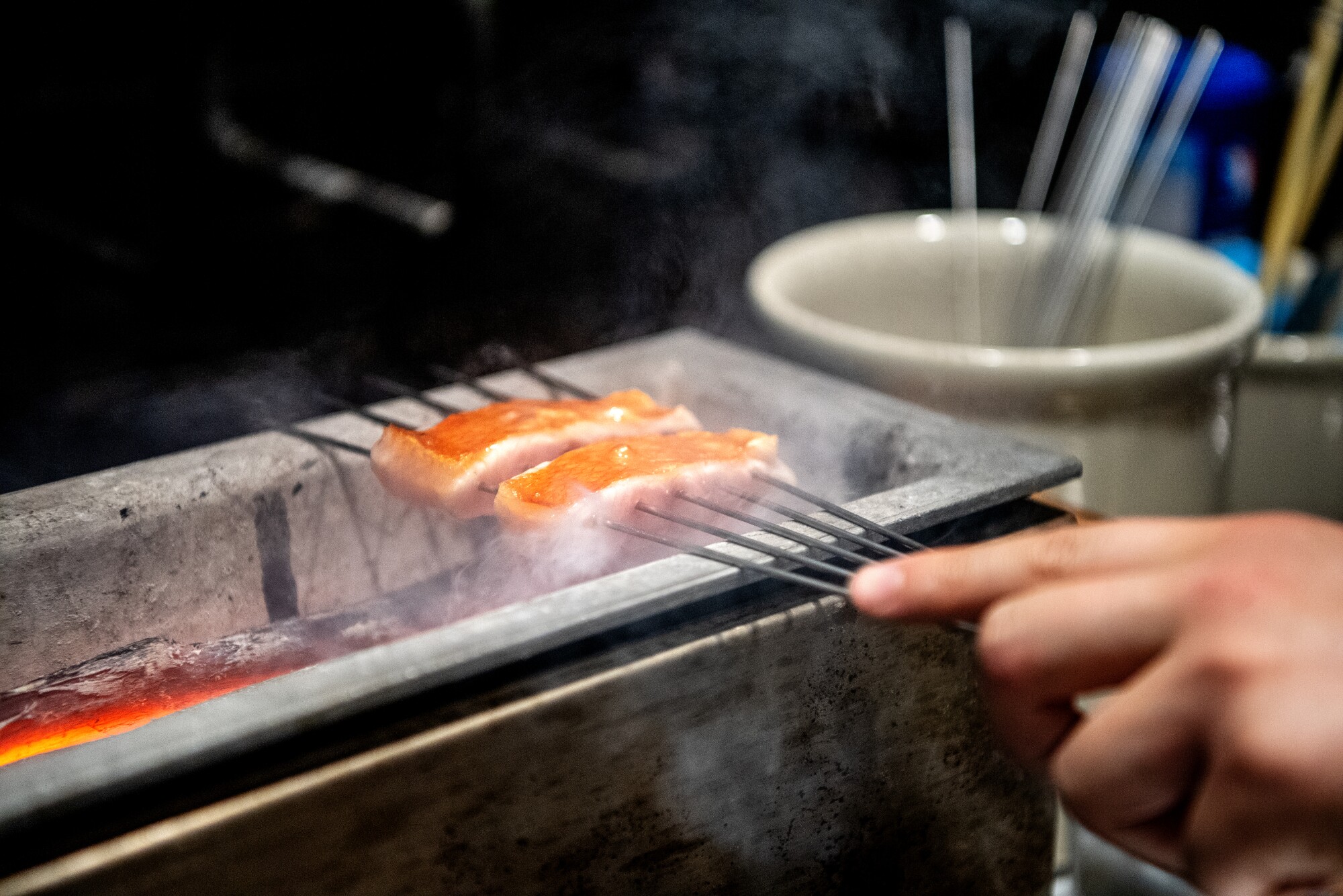 Chef Jon Yao prepares the Snapper course during service at Kato's new location at the ROW DTLA.