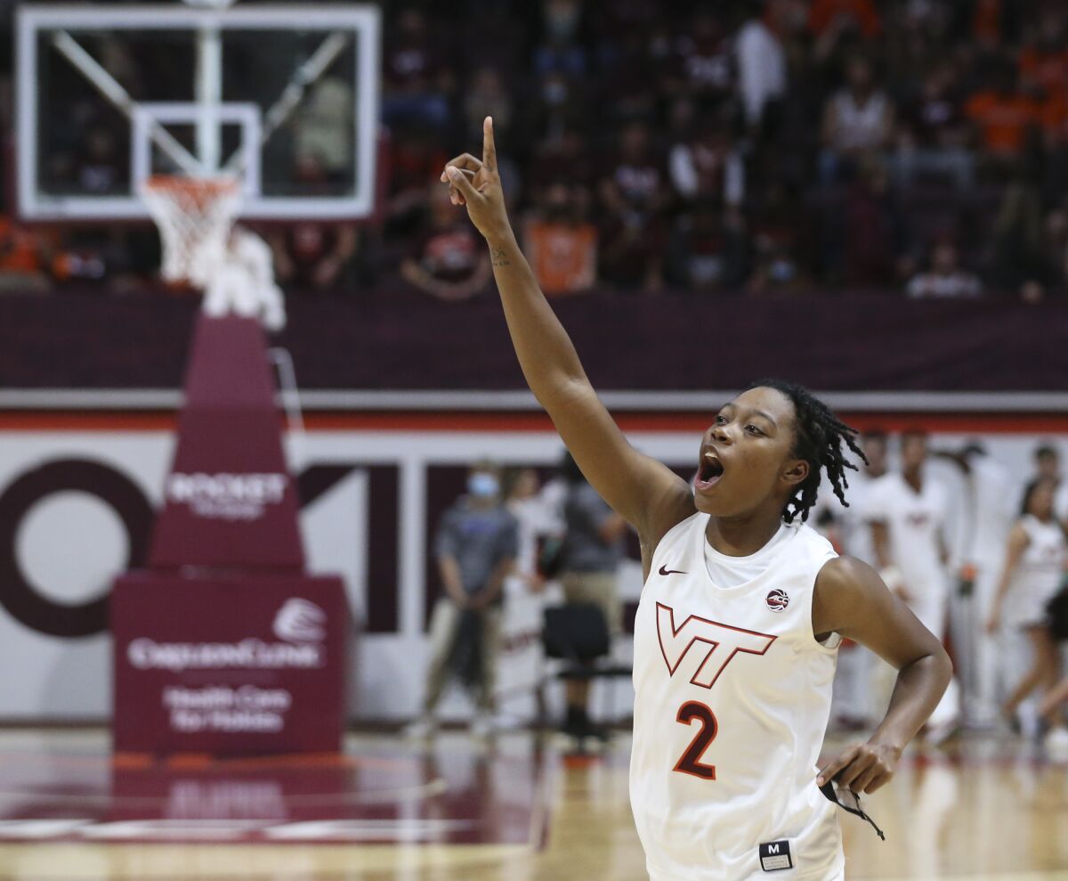 Virginia Tech's Aisha Sheppard (2) celebrates after the team's win over Davidson in an NCAA college basketball game in Blacksburg, Va., Tuesday, Nov. 9 2021. Sheppard scored 25 points and made 7 out of 10 3-point baskets. (Matt Gentry/The Roanoke Times via AP)