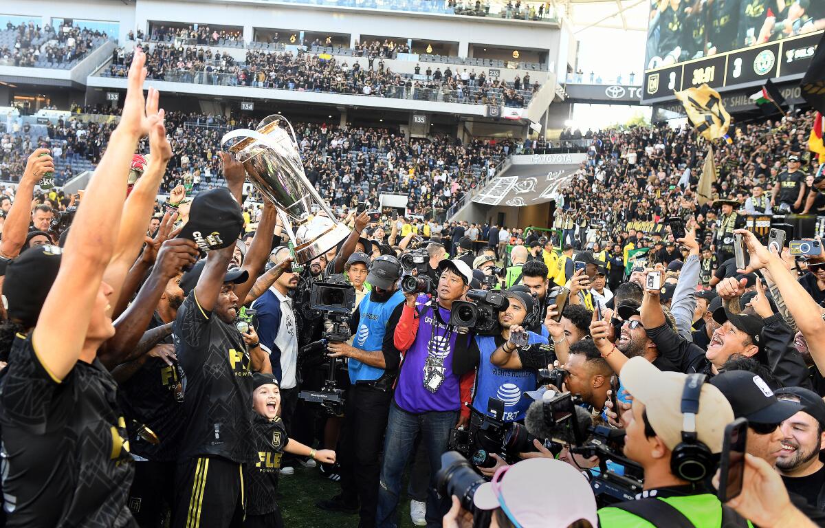 LAFC players celebrate after winning the MLS Cup on Saturday at Banc of California Stadium.