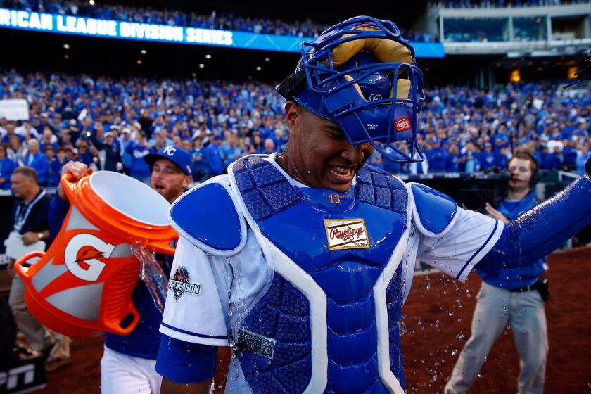 Royals catcher Salvador Perez celebrates after defeating the Houston Astros in Game 2 of the American League division series on Oct. 9.