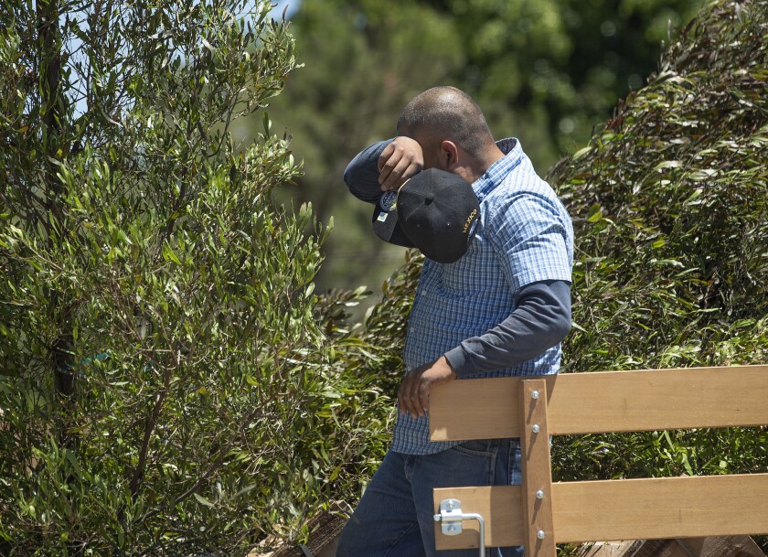 A worker in California wipes away sweat while unloading a truck last summer. NASA and NOAA say 2019 was the second-warmest year since 1880.