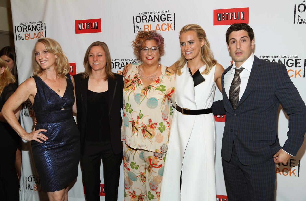(L-R) Author Piper Kerman, Netflix Vice President of Original Content Cindy Holland, Writer and Producer Jenji Kohan, Actress Tayor Schilling, and Actor Jason Biggs attend "Orange Is The New Black" New York Premiere at The New York Botanical Garden on June 25, 2013 in New York City.