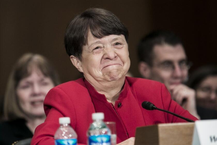 Mary Jo White, nominee for chairwoman of the Securities and Exchange Commission, testifies during her confirmation hearing before the Senate Banking Committee.