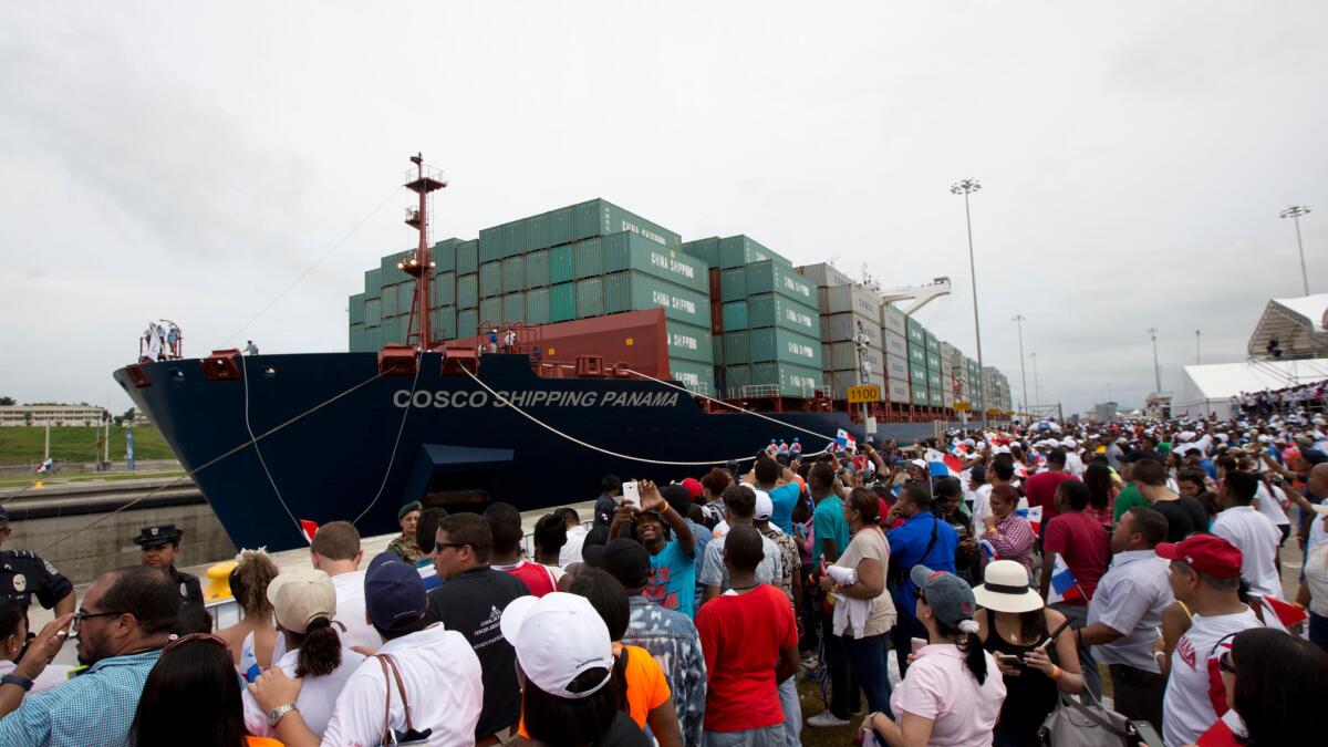 A cargo ship begins to cross the new Agua Clara locks, part of the Panama Canal expansion project, near the port city of Colon in Panama on June 26, 2016.