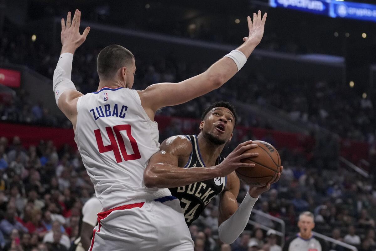 Clippers center Ivica Zubac hovers over Bucks forward Giannis Antetokounmpo