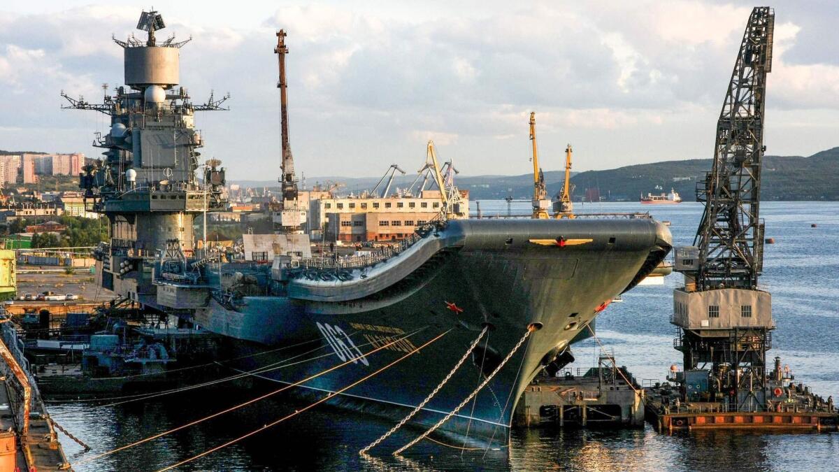 Russia's only aircraft carrier, the Admiral Kuznetsov, tied up in port in Murmansk in 2009. One person was missing and four others injured Oct. 30, 2018, after a giant floating dock holding the Kuznetsov sank at a shipyard near Murmansk.