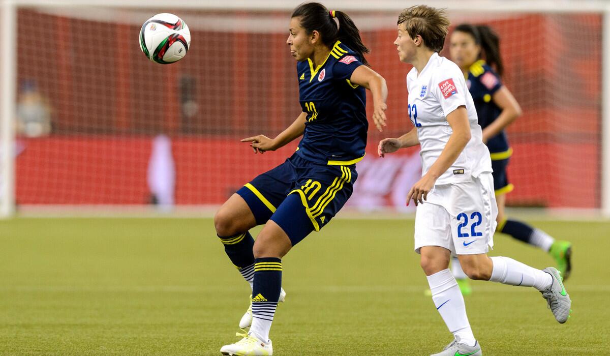 Coumbia's Yoreli Rincon and England's Fran Kirby chase the ball during a FIFA Women's World Cup match on June 17.