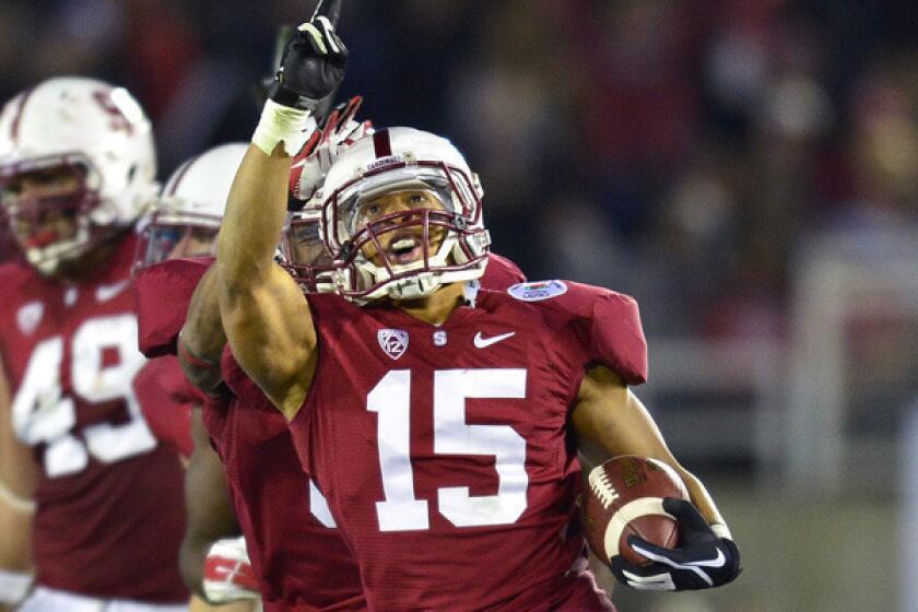 Stanford defensive back Usua Amanam celebrates after intercepting a pass by Wisconsin late in the Rose Bowl game last year.