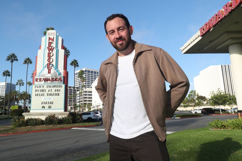 Parker Seaman, a Newport Beach native and director, is returning home to the Newport Beach Film Festival, where his movie "Wes Schlagenhauf Is Dying" is one of the featured films this year. Parker stands at the Regal Edwards Big Newport theatre on Wednesday, Sept 28.