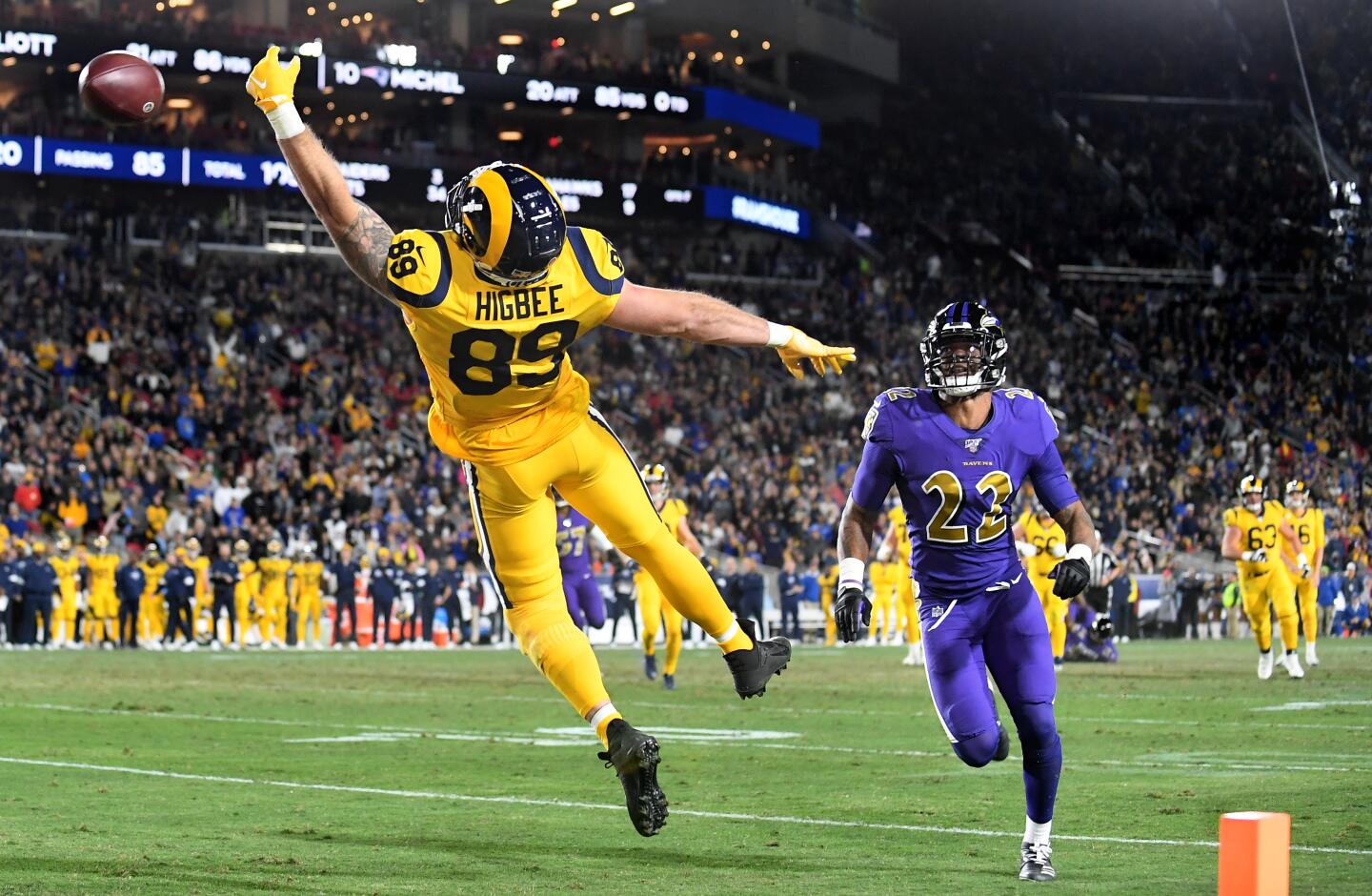Rams tight end Tyler Higbee can't make the catch in the end zone in front of Ravens cornerback Jimmy Smith during the second quarter of a game Nov. 25 at the Coliseum.