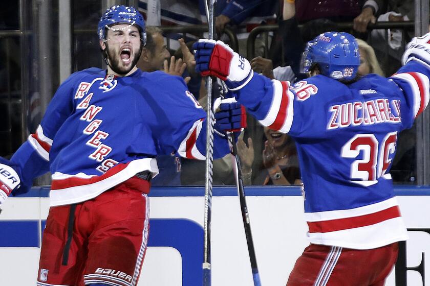 New York Rangers center Derick Brassard celebrates with teammate Mats Zuccarello after scoring during the second period of the team's 3-2 overtime win against the Montreal Canadiens in Game 4 of the Eastern Conference finals Sunday.