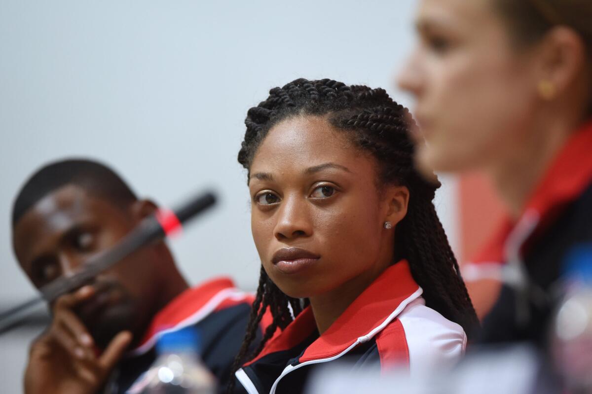 Allyson Felix of the United States, center, had been hoping to double in the 200 and 400 meters at the IAAF world championships in Beijing.