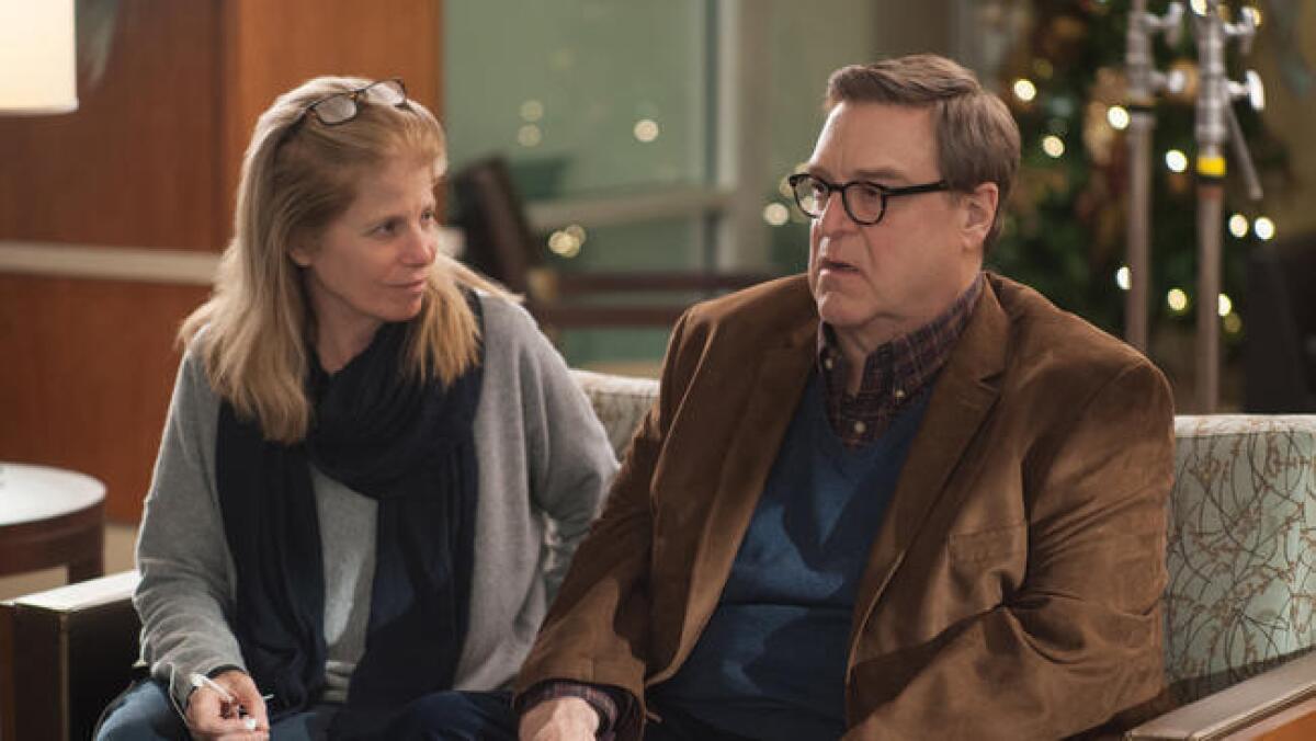 Jessie Nelson with John Goodman on the set of the film "Love the Coopers."