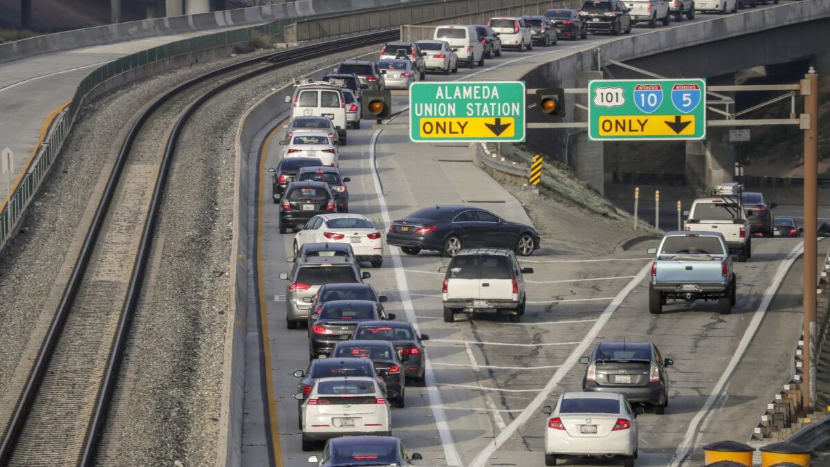 Chaotic morning traffic on the west toll road on the 10 Freeway. With travel speeds slowing in the toll lanes on the 10 and 110, Metro is considering ending free use for commuters who drive alone in plug-in hybrids and electric cars.