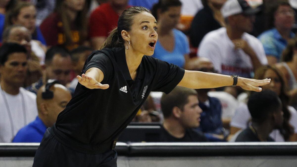San Antonio Spurs summer league Coach Becky Hammon instructs her players during a win over the Phoenix Suns in Las Vegas on July 20.