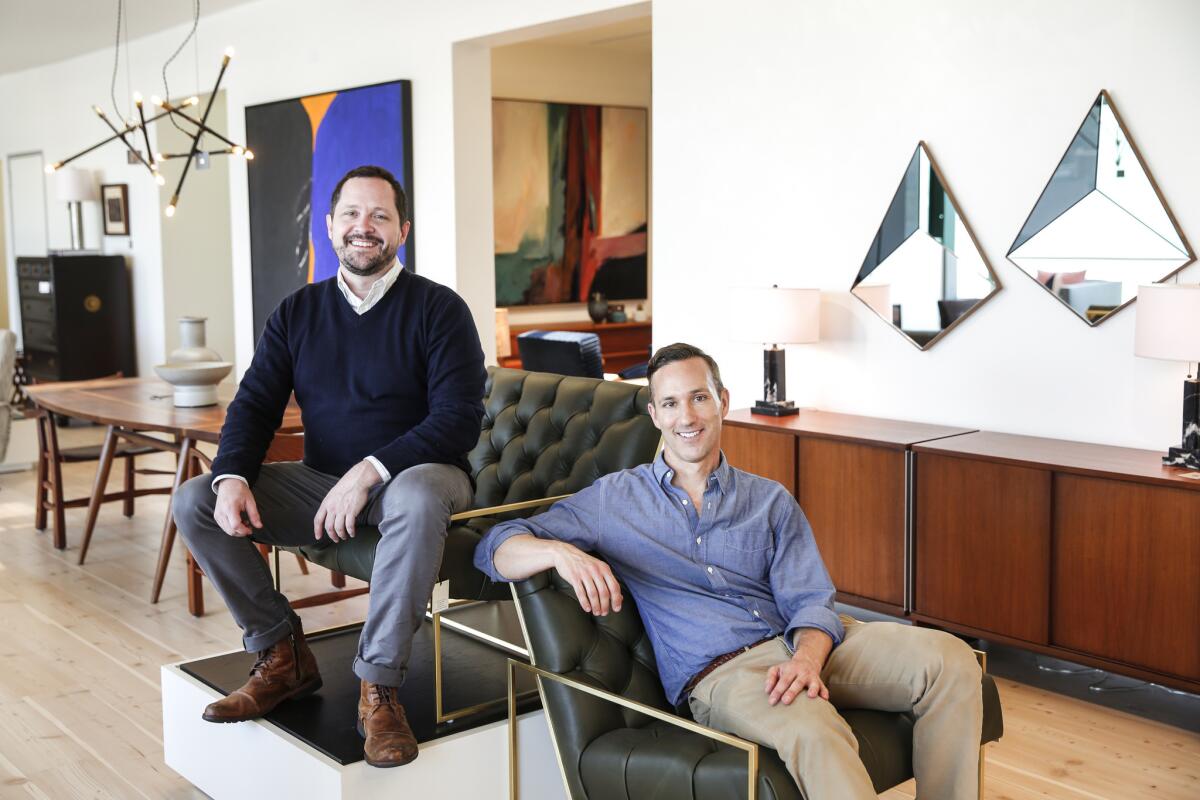 Glenn Lawson, left, and Grant Fenning founded Lawson-Fenning in 1997 while they were students at Art Center College of Design in Pasadena. They recently opened a new two-story showroom on Melrose Avenue, in which they are photographed.