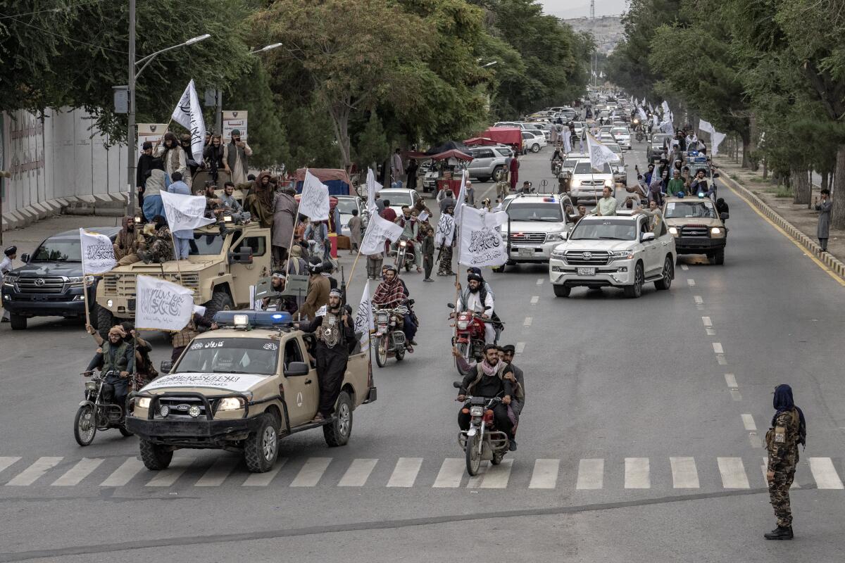 Taliban fighters hold a parade.