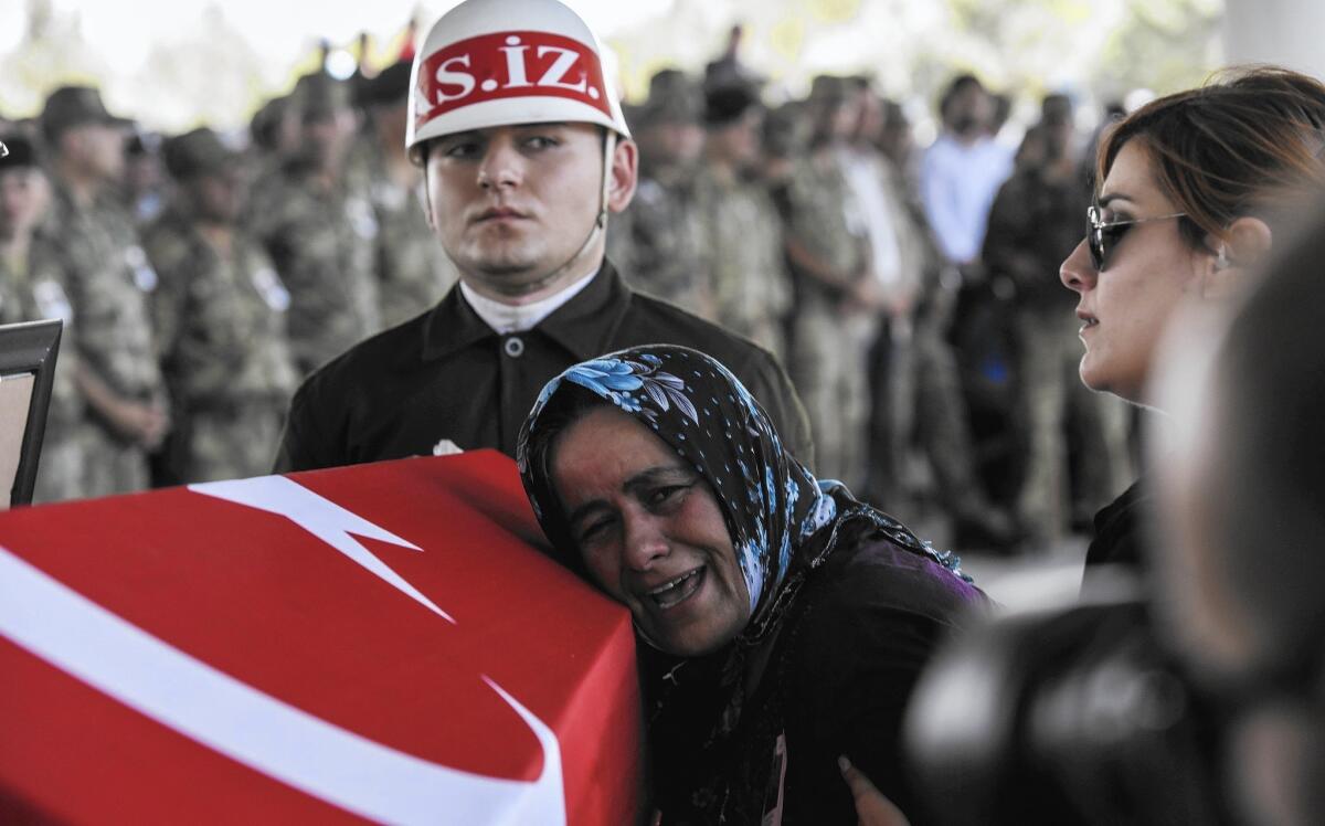 The mother of a Turkish soldier cries during his funeral July 24 in Gaziantep. The soldier died the day before in a cross-border clash with Islamic State extremists.