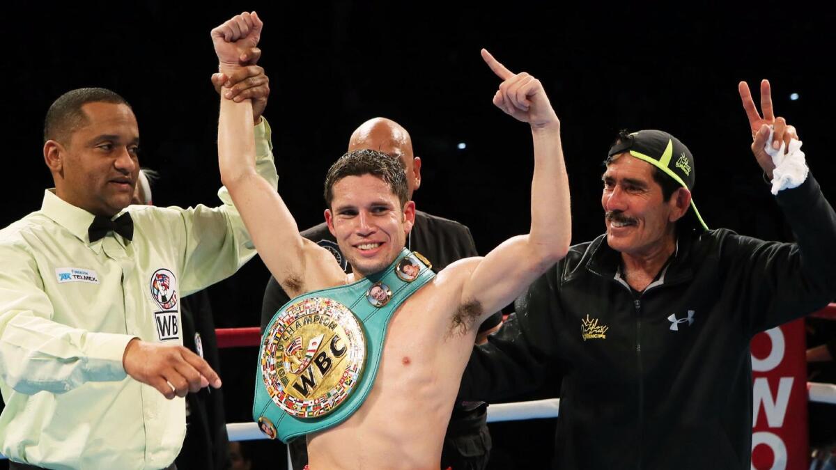 Carlos Cuadras celebrates after retaining his WBC super-flyweight title in Japan in 2015. He lost the belt the next year.
