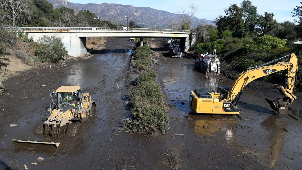 Crews continue cleaning mud from the 101 Freeway in Montecito. (Michael Owen Baker / For The Times)