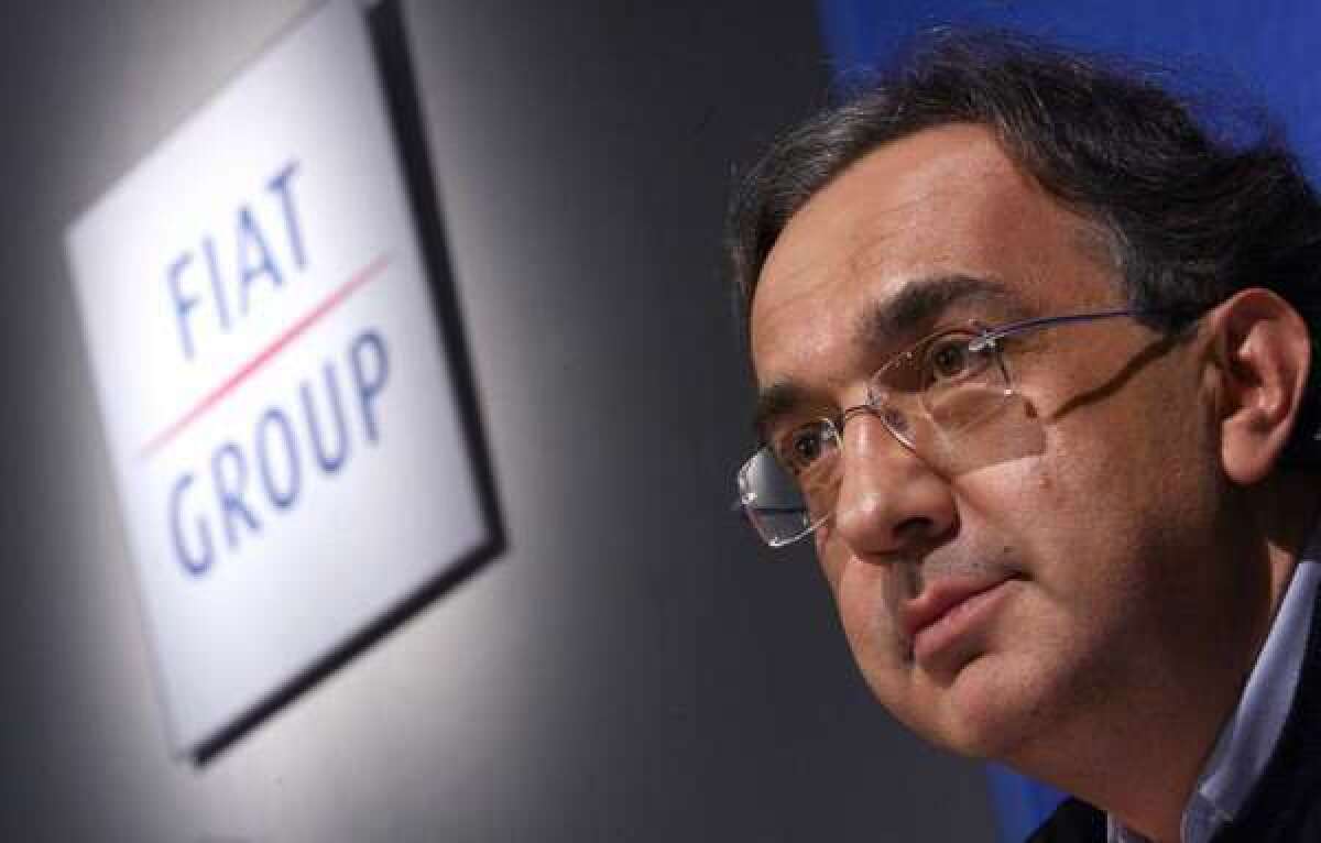 Fiat CEO Sergio Marchionne has hinted at reasons behind possibly moving the Italian company's headquarters to the U.S. In this 2007 photo, he talks to shareholders in Turin, Italy.