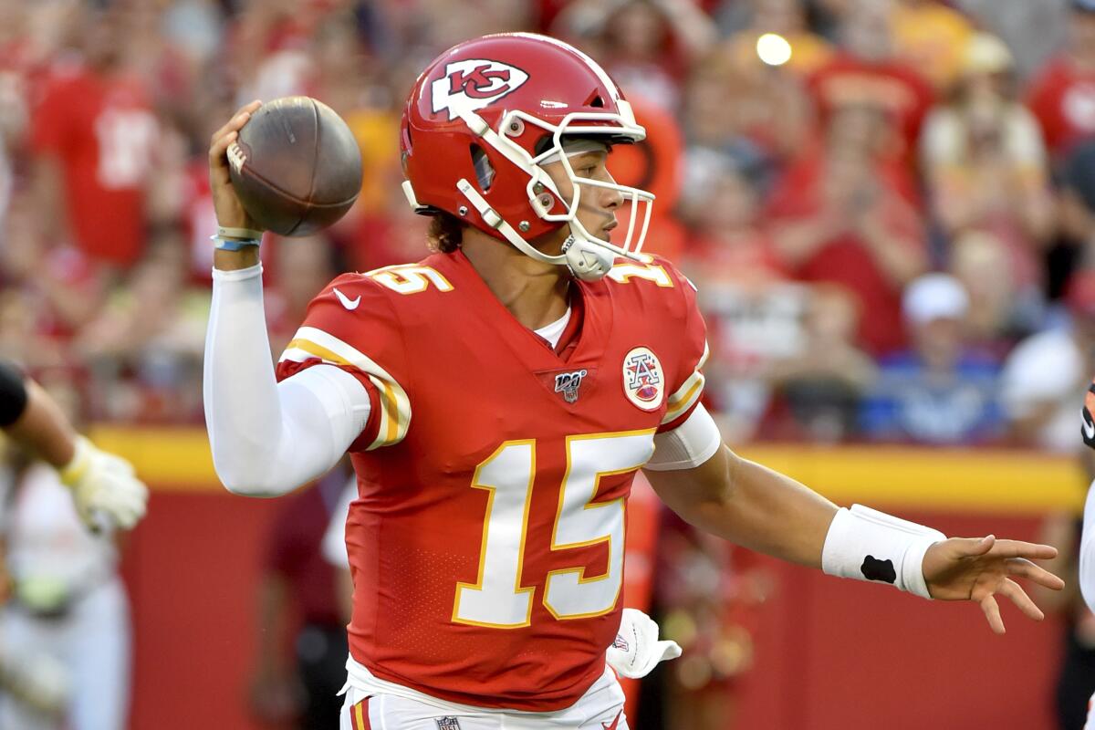 Chiefs quarterback Patrick Mahomes looks for a receiver during his team's 38-17 rout of the Bengals.