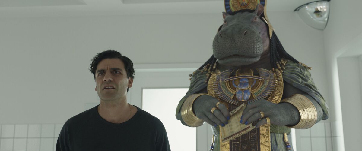 a man and a hippopotamus goddess