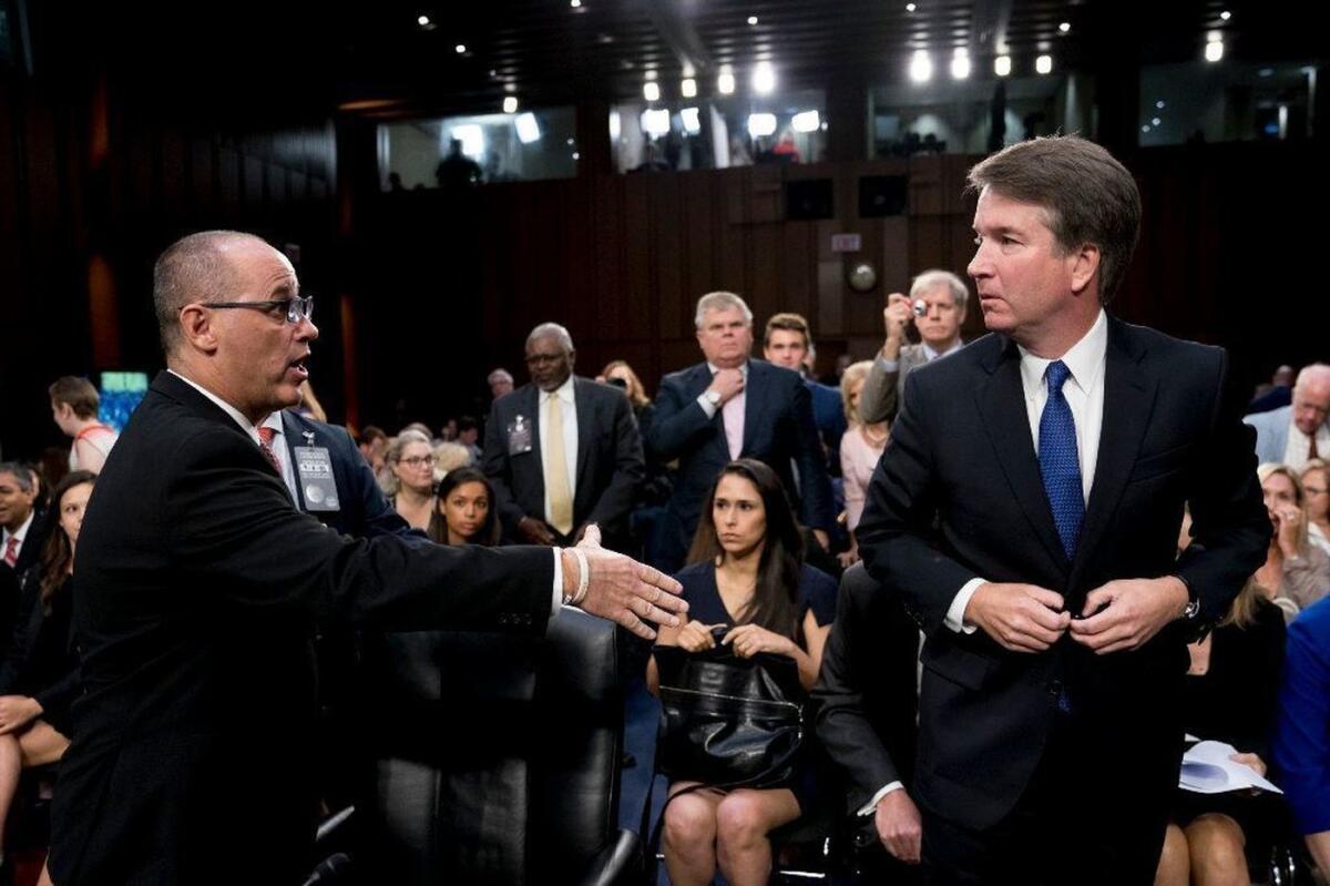 Fred Guttenberg attempts to shake hands with Supreme Court nominee Brett Kavanaugh on Sept. 4.