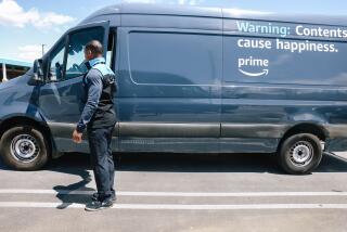 Palmdale, CA - May 05: Johnathon Ervin, owner of Battle-Tested Strategies, a logistics company that delivers Amazon products, inspects a a delivery vehicle that was grounded at their delivery parking lot on Friday, May 5, 2023 in Palmdale, CA. Ervin has decided to voluntarily unionize the company and wonders if Amazon is retaliating against his company. (Dania Maxwell / Los Angeles Times).