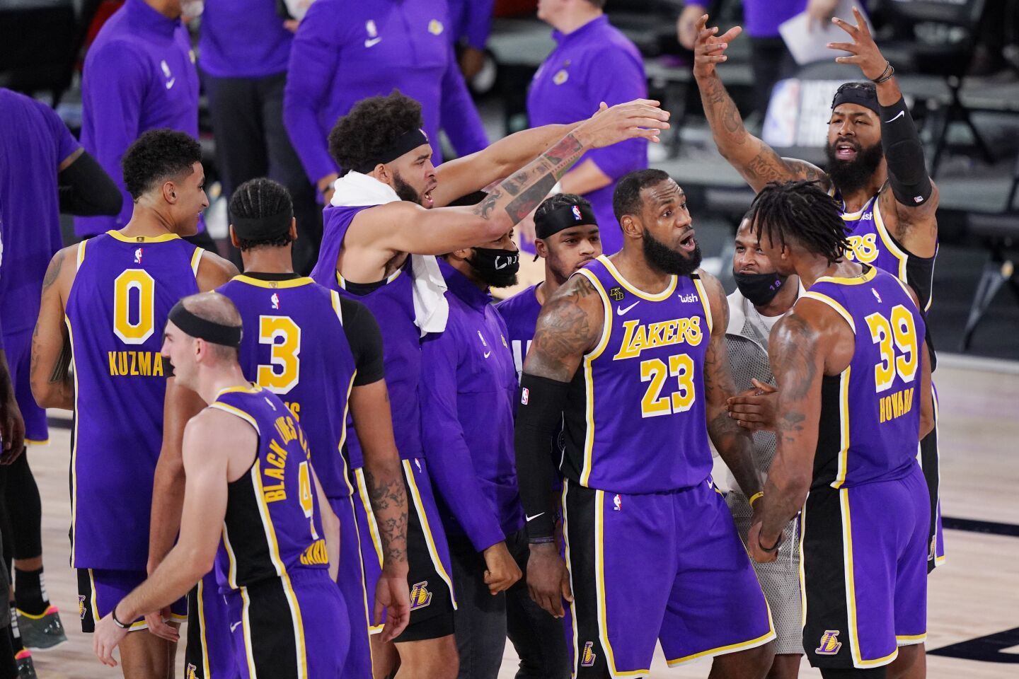 LeBron James (23) and his Lakers teammates celebrate after winning Game 5.
