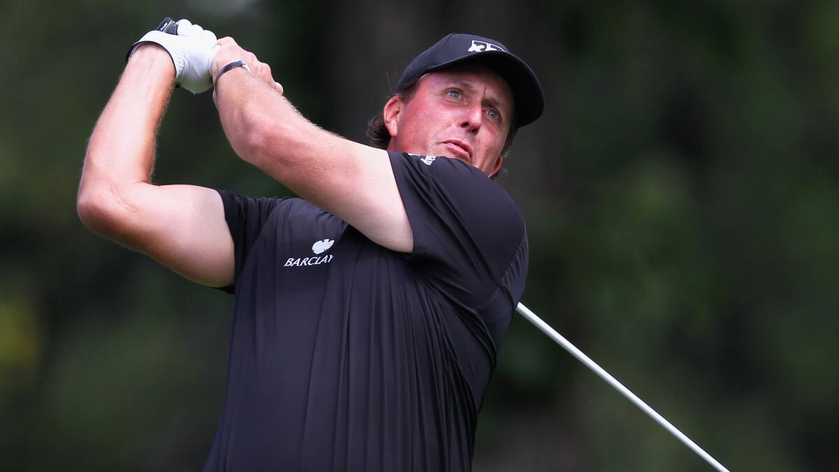 Phil Mickelson hits a tee shot during the second round of the BMW Championship in Cherry Hills Village, Colo., on Friday.