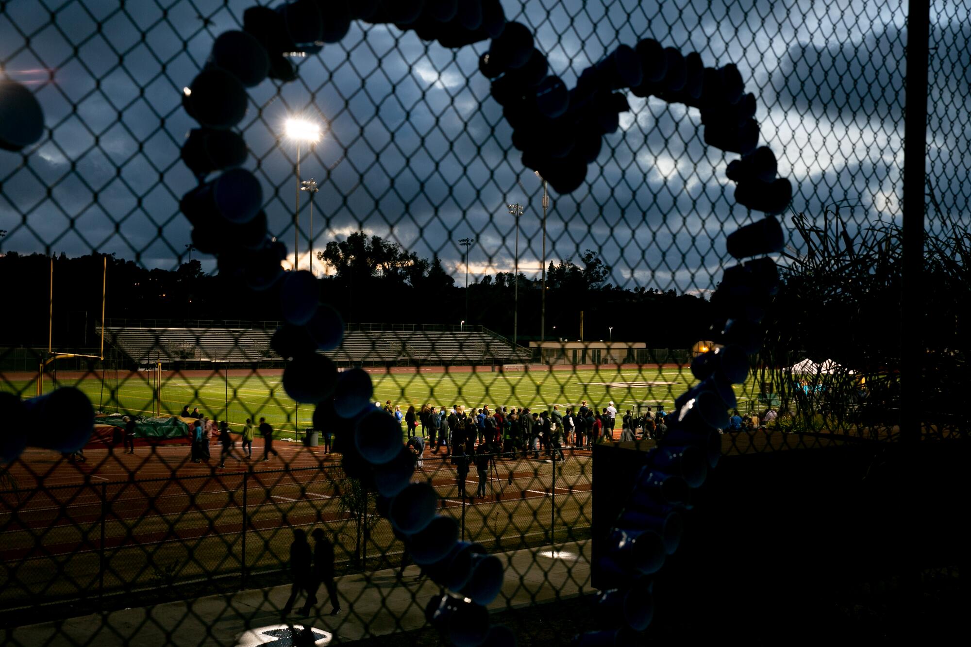 Community members gather at Poway High School on April 29, 2019, for a vigil following the shooting at Chabad of Poway.