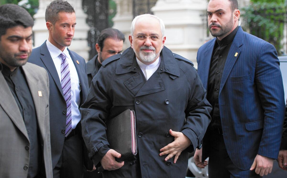 Iranian Foreign Minister Mohammad Javad Zarif, center, arrives for a meeting in Vienna. Iran and six world powers face a Nov. 24 deadline for a nuclear deal.