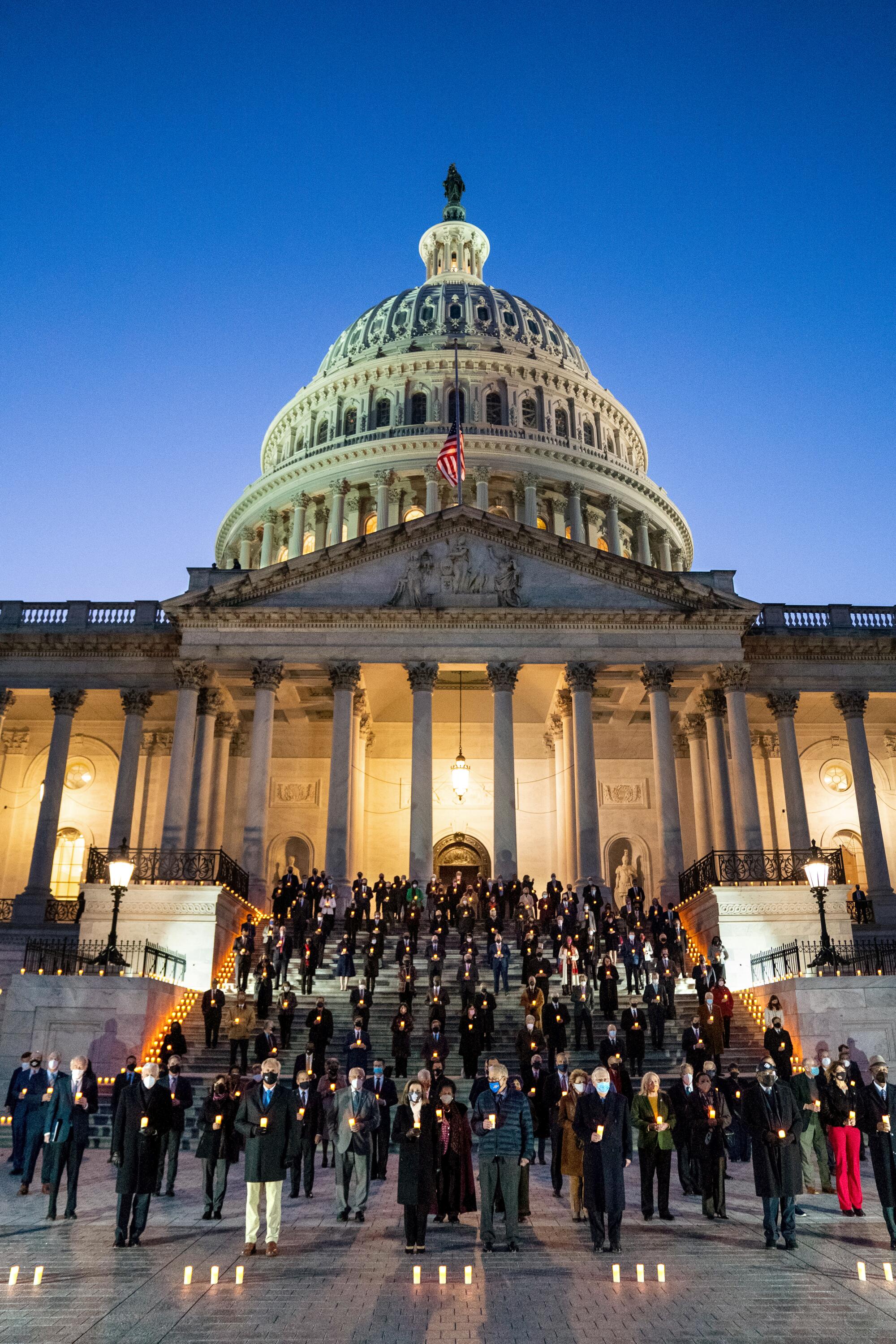 Members of the 117th Congress hold a moment of silence for the 500,000 American lives lost to COVID-19.